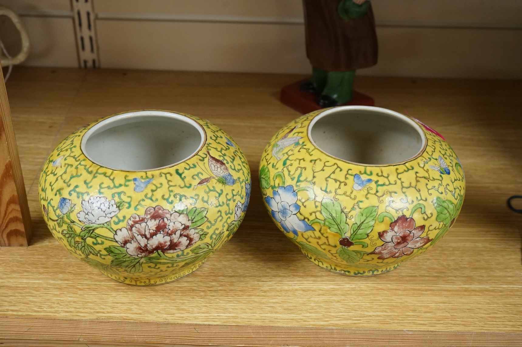 A Chairman Mao porcelain figure and a pair of Chinese yellow ground bowls decorated with flowers and insects, largest 30cm high